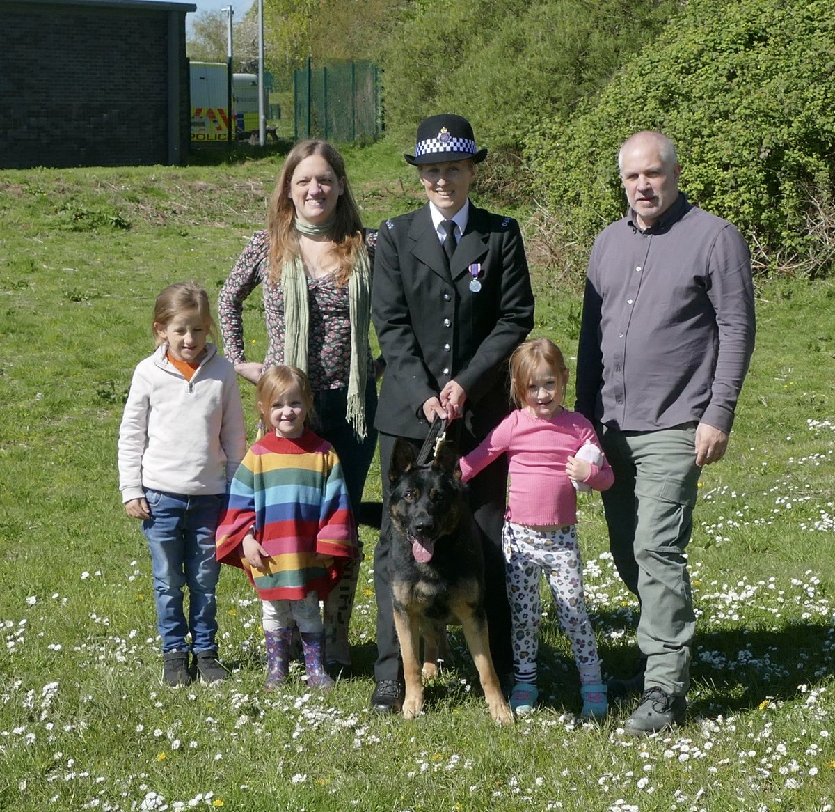 Lovely to see handler Laura with PD Maverick being reunited with his puppy walkers James, Laura and their children at the passing out parade today.