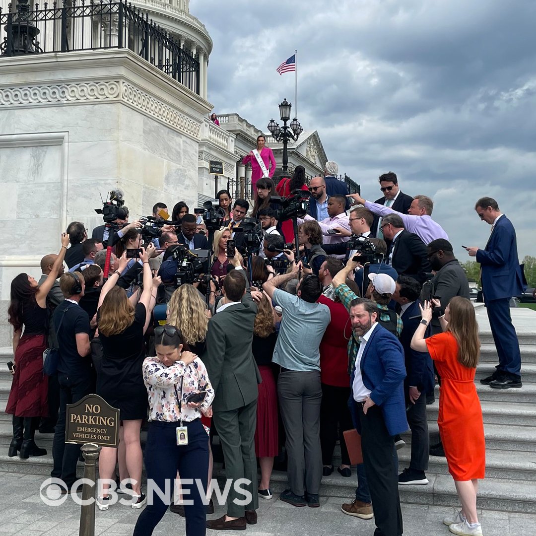 CBSNews's tweet photo. A photo by CBS News' @MacFarlaneNews captures the swarm of press around Rep. Marjorie Taylor Greene (R-GA) as she spoke on the steps of the U.S. Capitol Thursday morning. 

Greene's threat to oust House Speaker Mike Johnson gained momentum this week as another Republican, Rep. Thomas Massie of Kentucky, said he'd co-sponsor Greene's motion to vacate.