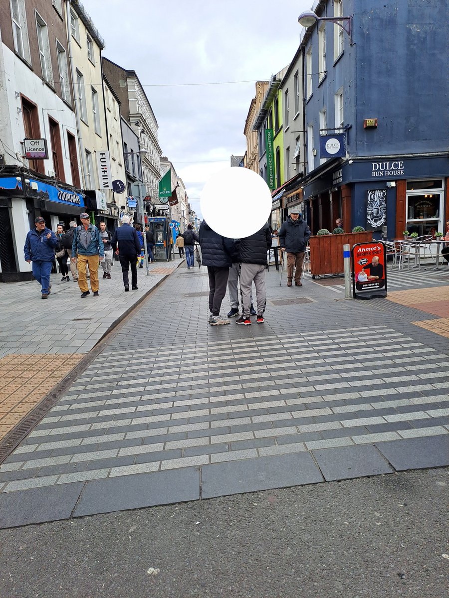 This is Cork's main shopping St - Oliver Plunkett St - at 2pm today. 3 guys openly dealing - their customers aggressively begging to get the cash @corkcitycouncil & Gardai need to be a lot more proactive on this.