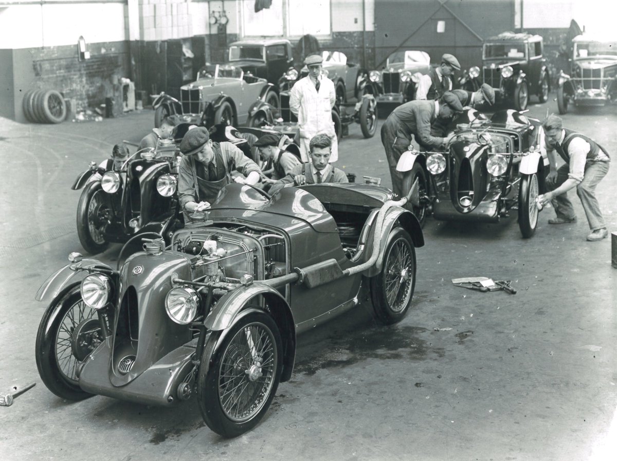 A throwback photograph to 1932 MG C Type Midgets being prepared in Abingdon factory for a ‘Double Twelve Race’ at Brooklands. The exhibition 'MG 100 - Evolution of an icon' is on view until 30th June 2024. #MG100 #MGCars #MG #Abingdon #Oxfordshire