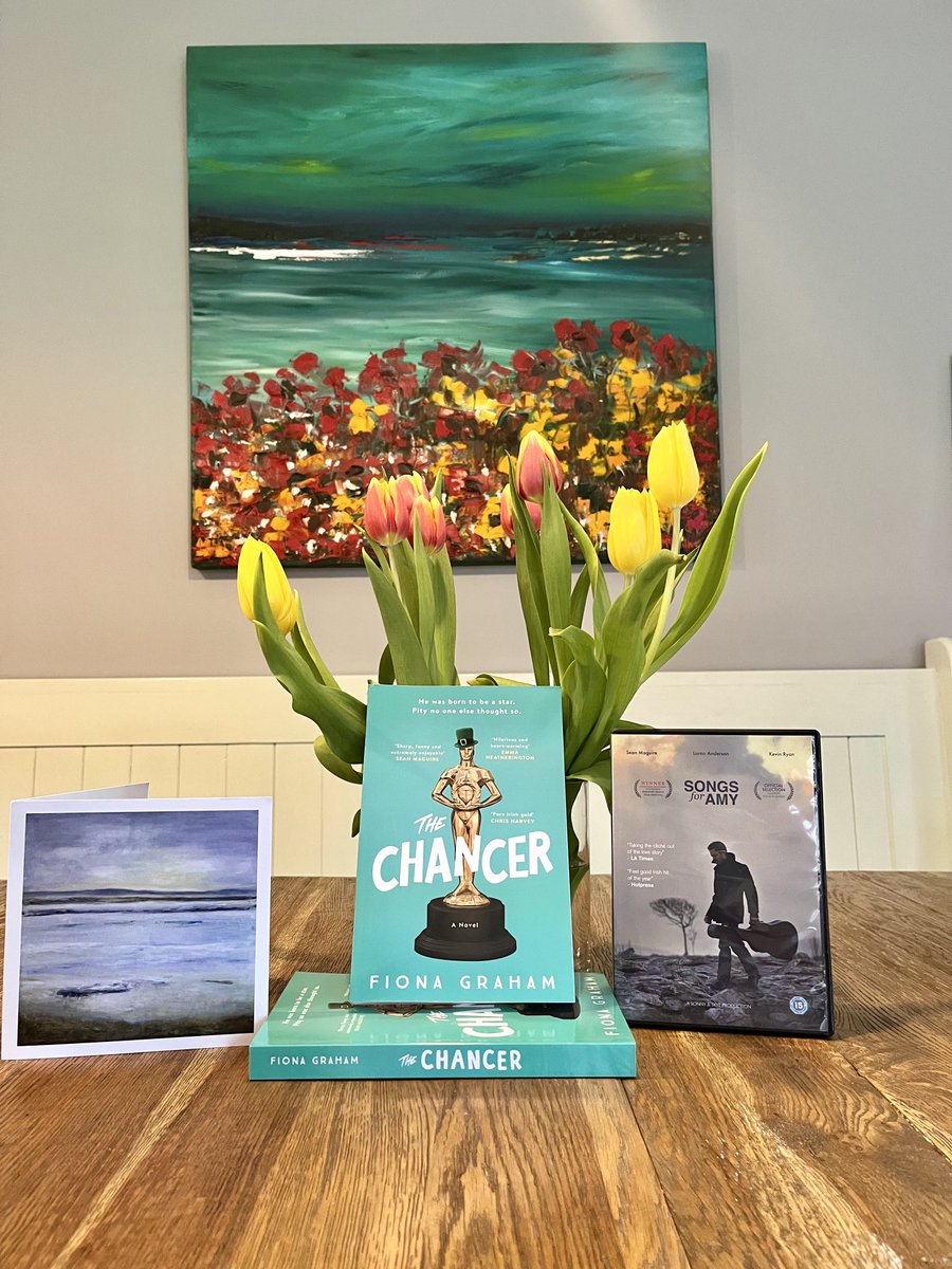 Family pic: my sister’s painting on the wall, my mother’s painting on a card, with my novel The Chancer and movie ⁦@songsforamy⁩ (both available from Amazon). The tulips, however, are nothing to do with my family - I bought them in Aldi! #goodreads #moviestowatch #art