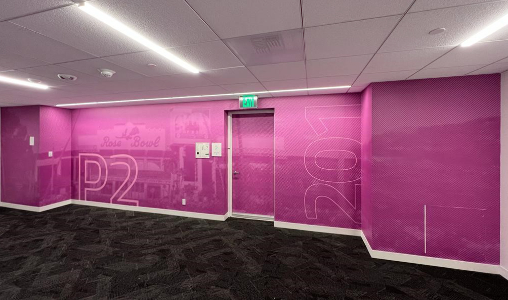 Adding floor and room number supergraphics into your larger wall covering design creates a stunning addition to your wayfinding system. In this project, each elevator lobby was assigned its own color to further differentiate between the spaces.
#wayfinding #signage #wallcovering