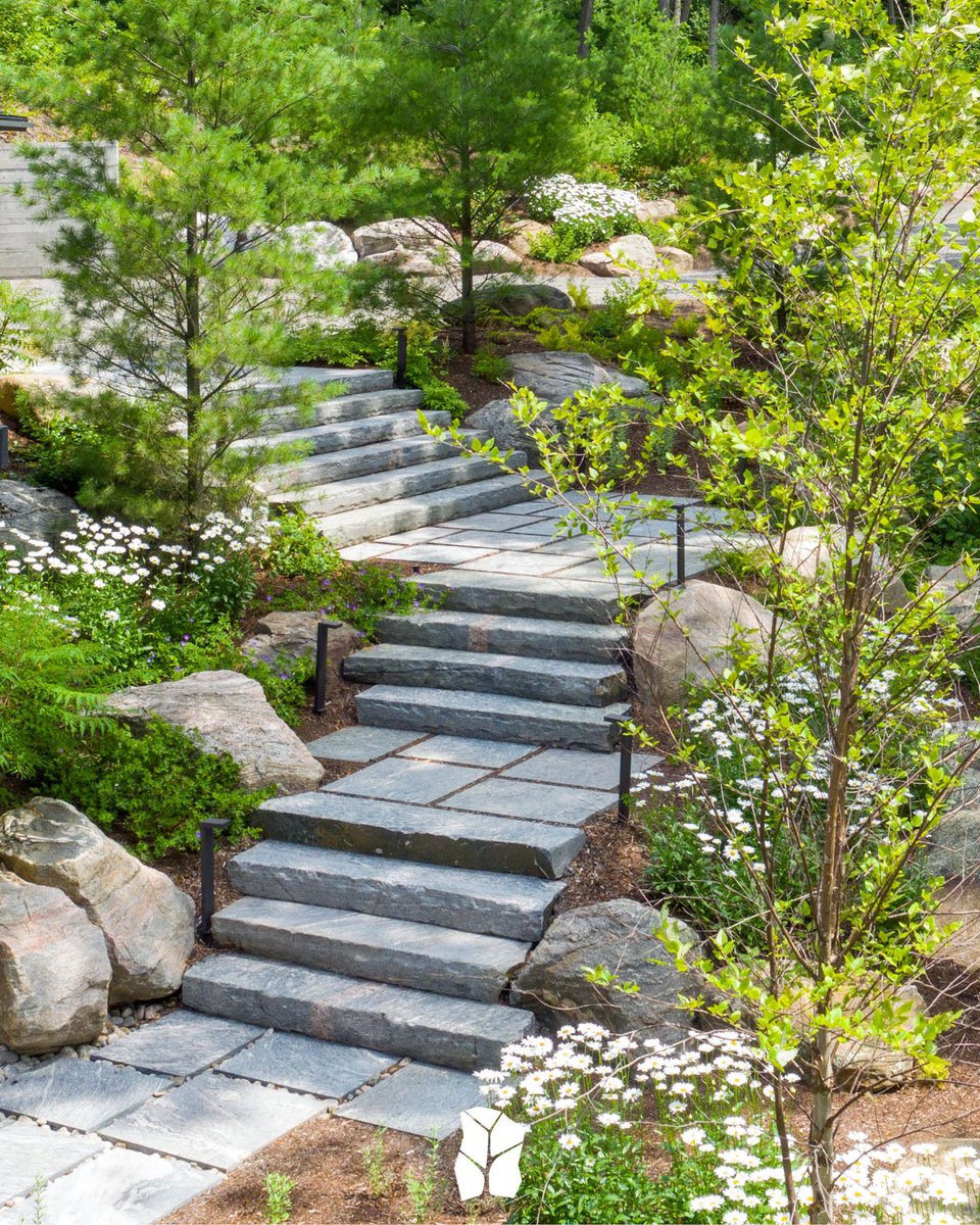 Throwback to this rock' n bloom project blending gorgeous stone with vibrant greenery and cheerful daisies - for a stairway to 'petal-perfect' paradise! 🪨🌼 #TBT

📲 Rockscape.ca

#cottagelife #muskoka #lightingdesign #ontariolandscaping #muskokalakes #granitesteps
