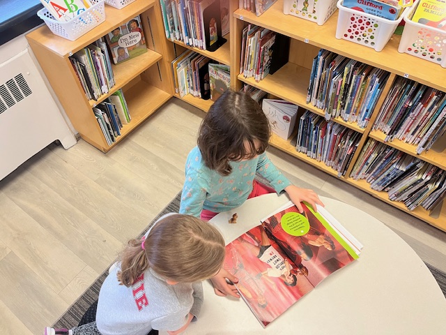 Is there anything better than tucking in reading a good book (yep - the @taylorswift13 book is still making the rounds!) on this rainy, dreary day! #friendsreadtogether #librarylove #booklove #kidslovelibraries #schoollibraries #heartoftheschool