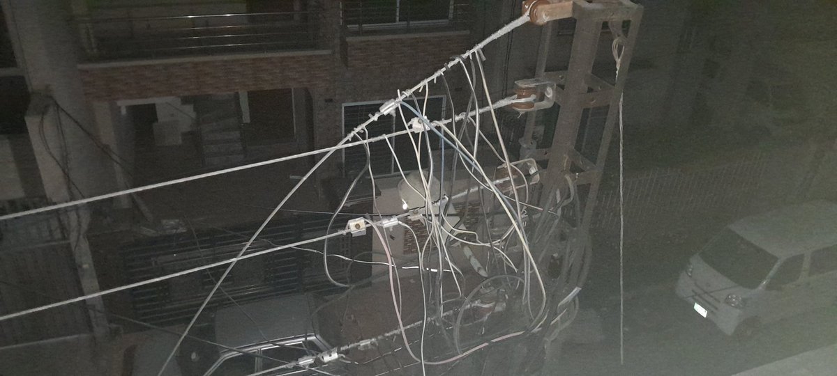 ahmararif's tweet photo. @Lescoofficial we have a live main lesco wire fallen and we have logged complaint 20 mins ago and still no one has taken any action. If anyone got hurt its on lesco. 3 wire are ok and rest street has electricity running. Its infront of our door. https://t.co/9c0PMzUyuX