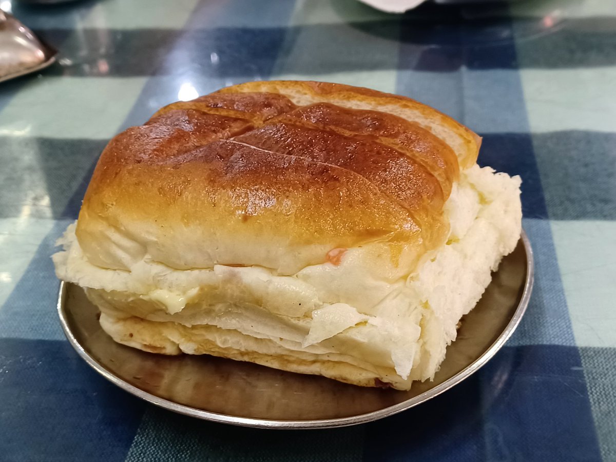 Brun Maska at the Cafe Goodluck at Deccan Gymkhana in #Pune. 
PS: Since I don't like bread too much, it was @MandarDeodhar4 who did the honours... 

#Food #PuneFood #PuneRestaurants #eatingout #diningout #khawayya #khaugiri #Pune #IraniCafes