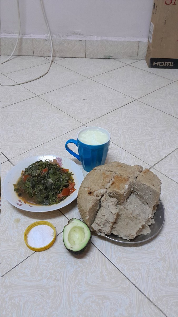 Jute mallow, avocado, fermented milk, and ugali for supper.