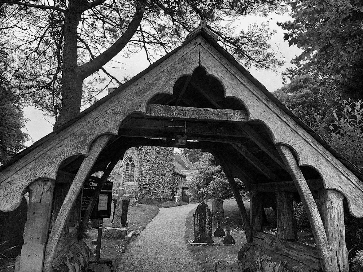 The lychgate or resurrection gate is a nexus of English folklore. It's wraith way terminus, border post of the Empire of the Dead. Lyke-wake dirges leak from it to echo across time. Church grims sit in its cover to growl at untoward boneyard visitors. – #CLNolan #FolkloreThursday