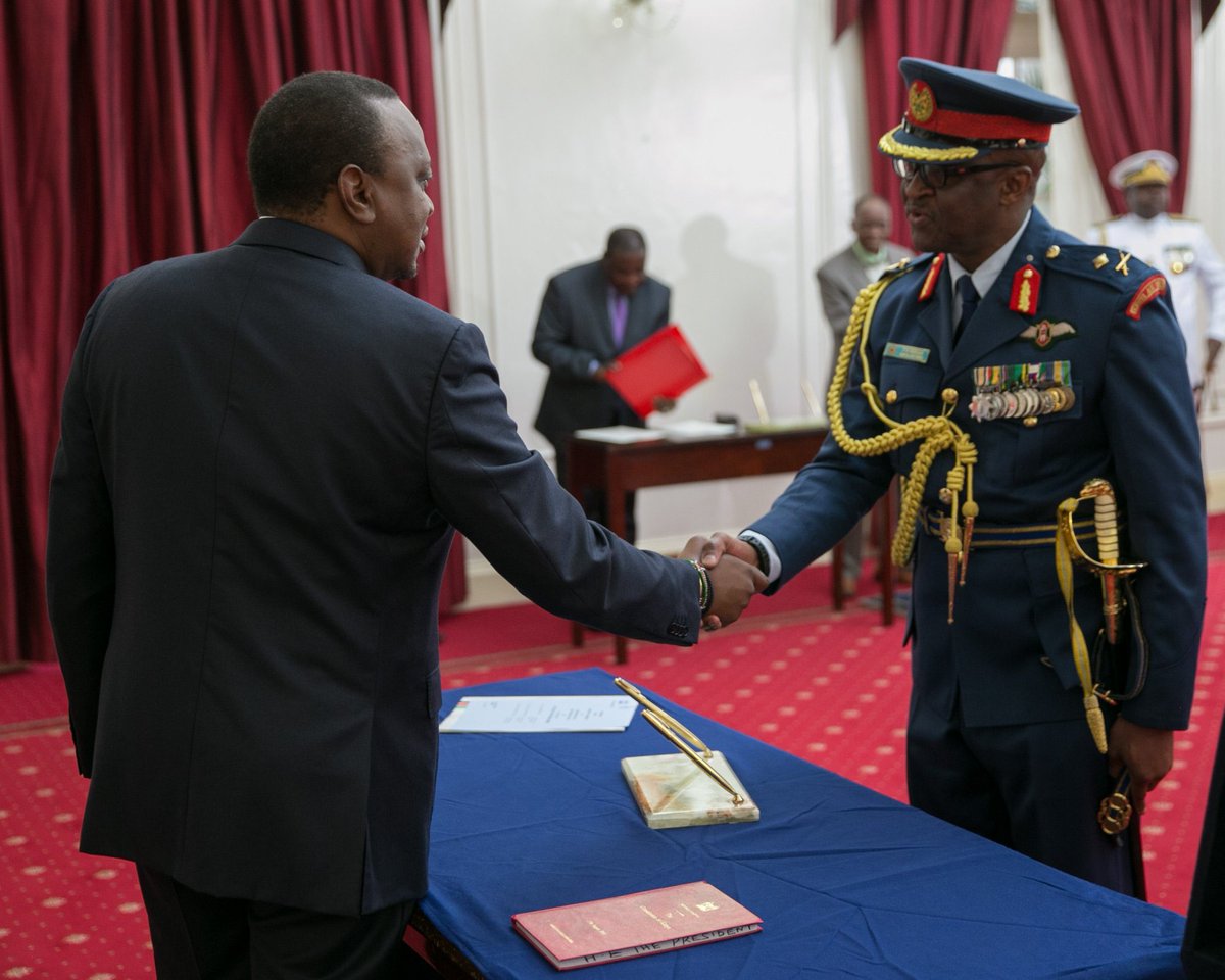 Retired president Uhuru Kenyatta with the fallen general CDF Ogolla