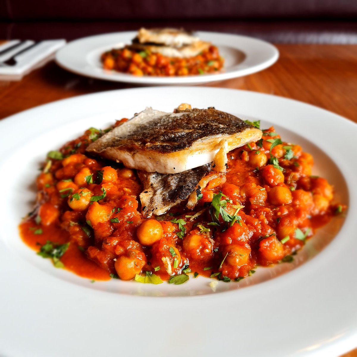 Another tasty dish on our menu, roast cod with this tasty chick peas & tomato stew We tried it first with the sea bass in this photo 😉 Also new on our menu now are courgette soup and crispy salt & pepper cuttlefish