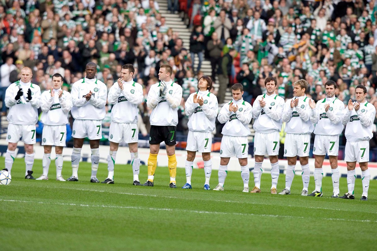 Celtic players in smart tracksuits, all wearing number 7 shorts in tribute to Jimmy Johnstone, before 2006 LCF v Dunfermline.