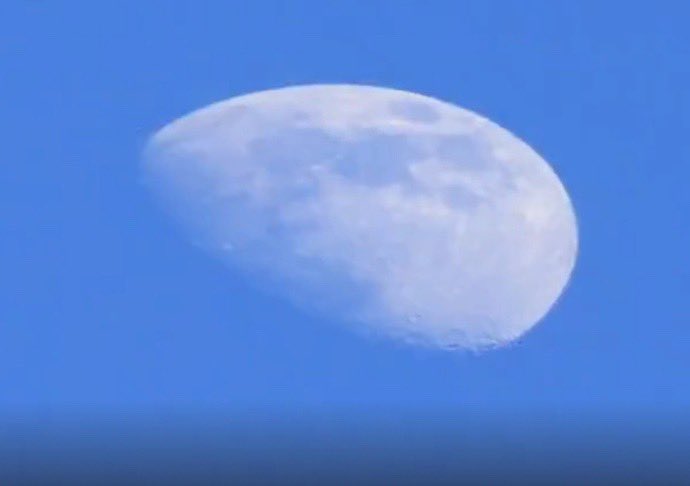 What’s up with the moon today? I can see the clear blue sky behind it.