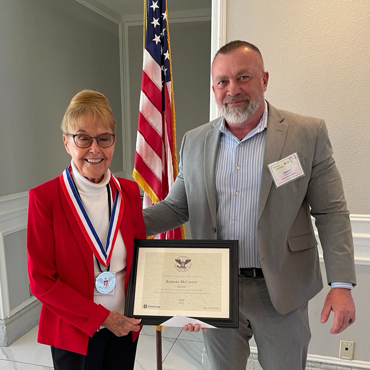 St. Lucie County Deputy Administrator Jason Davis presents resident Barbara McCarthy with the President’s Silver Volunteer Service Award for the 403 hours of volunteer work she contributed to the Morningside Branch Library. #volunteers #volutneerappreciationmonth