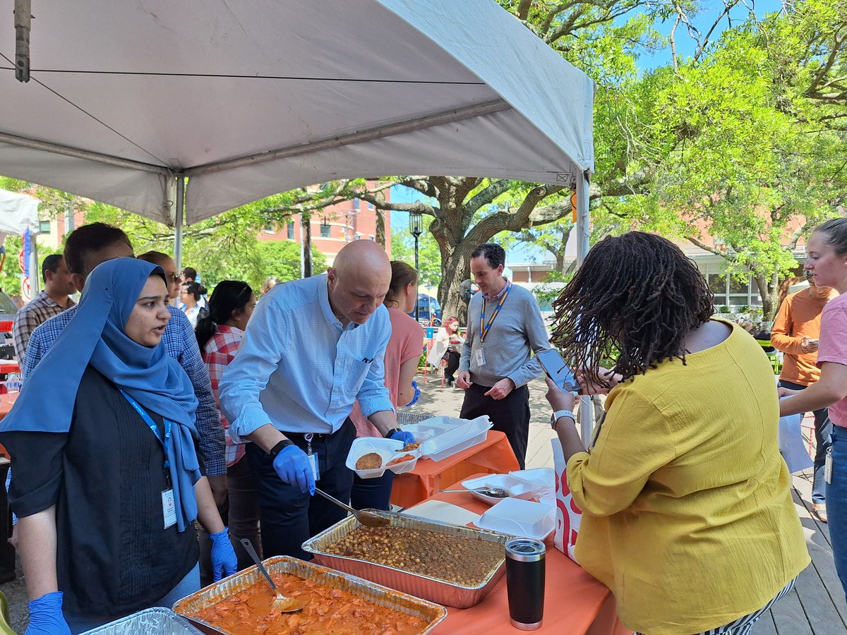It's a beautiful day for celebrating all the international cultures at MUSC - and for enjoying some Indian food dished up by Team ImmunoT for their Lowvelo fundraiser. Dr. Besim Ogretmen takes a break from his lab to serve hungry employees and visitors.