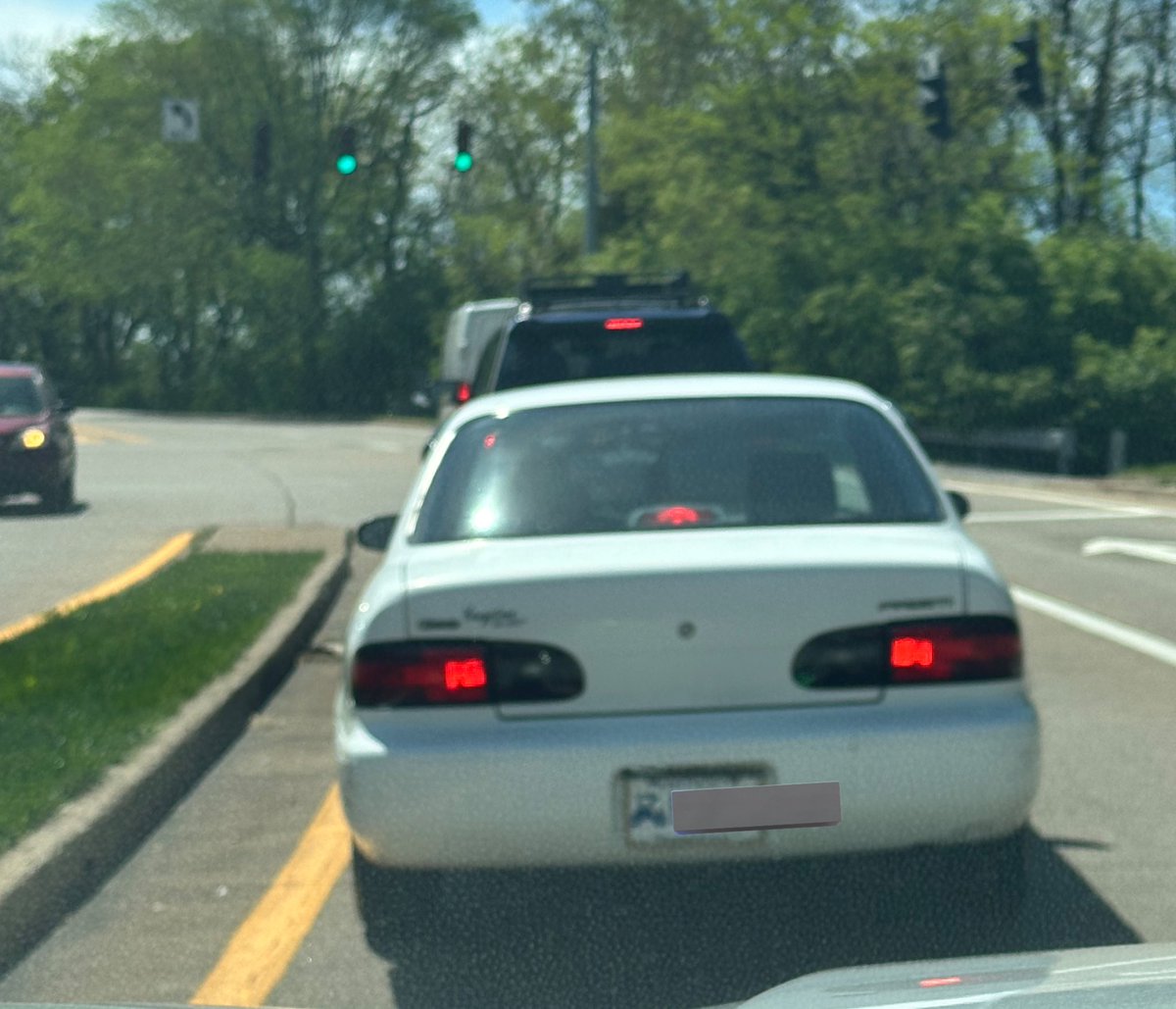 Growing more gray hair as we speak thinking about this Geo Prizm with a “historical car” license plate.