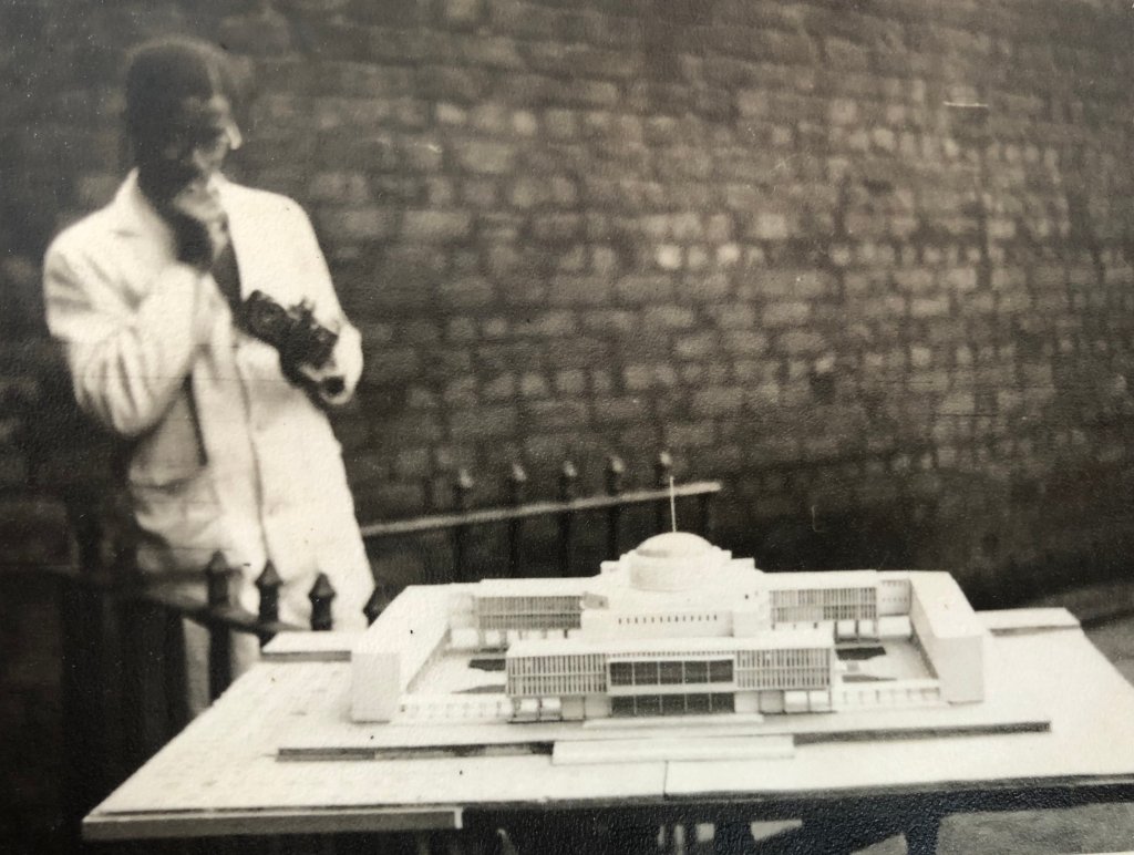 JFenton_R's tweet photo. A shot of Ghanaian architect Peter Turkson at Liverpool Uni, with his architectural model for a new parliament building in Accra, 1954. Briefly mentioned in the V&amp;A Tropical Modernism exhibition. 

I can just tell from this photo he was a ridiculously cool guy. https://t.co/IzQzJJbKpL