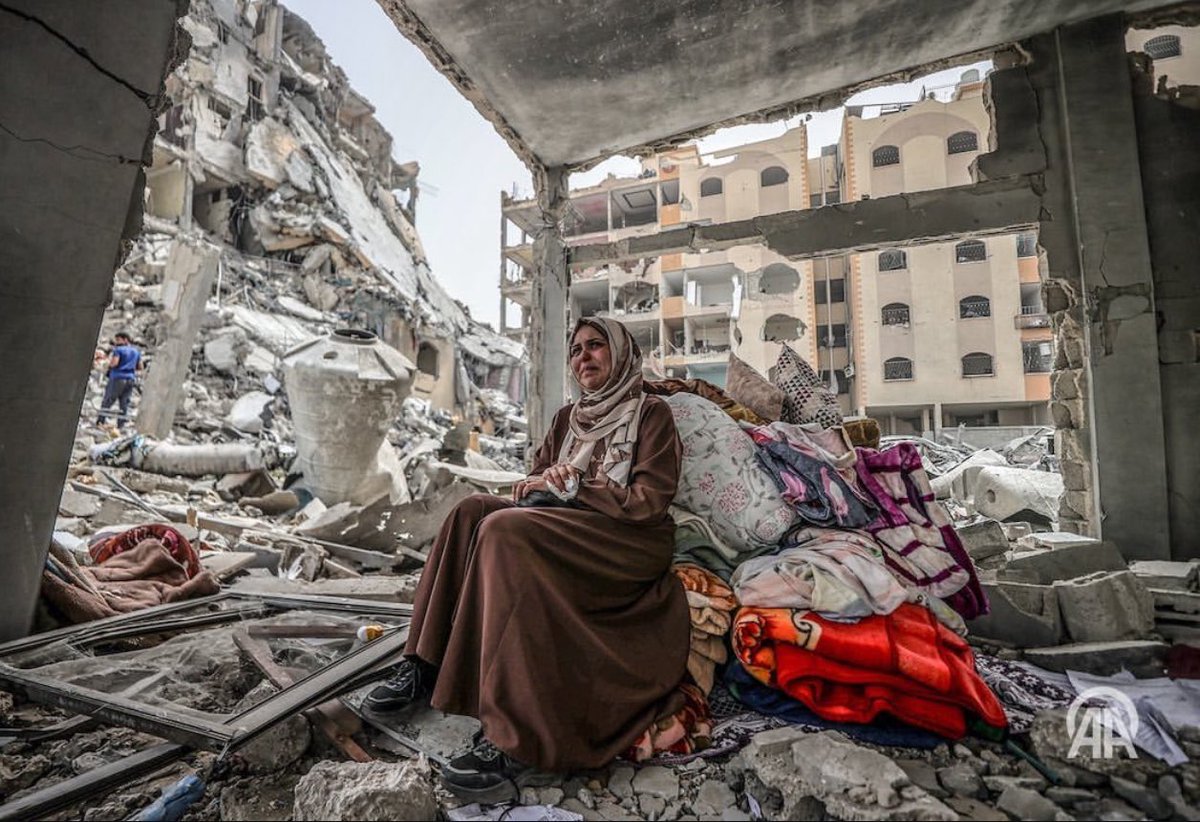 Palestinians living in Nasirat Refugee Camp collect the usable items among the rubble of the destroyed buildings after Israel withdrawal from northern Nasirat Camp in Deir Al Balah, Gaza on April 18, 2024. (Photo by Ali Jadallah/Anadolu via Getty Images)