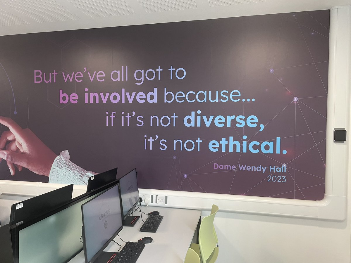 DameWendyDBE's tweet photo. I also met some A level computer science students and their teachers. We took a photo by my quote about the need for diversity in AI which is writ large on the wall as you enter the building and will hopefully inspire others. Well done @bartonpeveril https://t.co/Fmn0pWUjgE