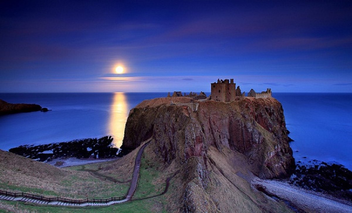 Dunnottar Castle is a ruined medieval fortress located upon a rocky headland on the N.E coast of Scotland, about 2 miles south of Stonehaven. The surviving buildings are largely of the 15th and 16th centuries. Wikipedia. NMP.