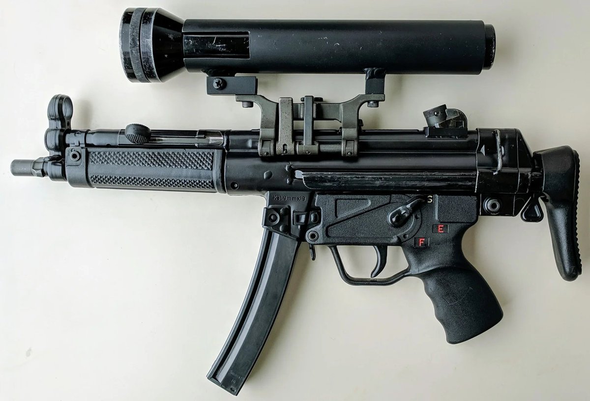 Hi there, and welcome to #FridayFucksorSucks, a weekly game with simple rules.

Today, we have the MP5 SAS Maglite Configuration. Also known as the 'Operation Nimrod' MP5, a flashlight was mounted using the top claw mount and the slings were set tight as a stock of sorts.

Vote!