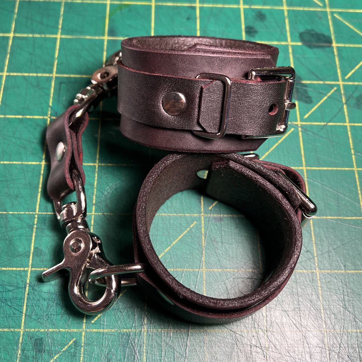 Just listed two pairs of heavy bondage cuffs made from black and brown leather with red edge dye, fit 9' and 6'