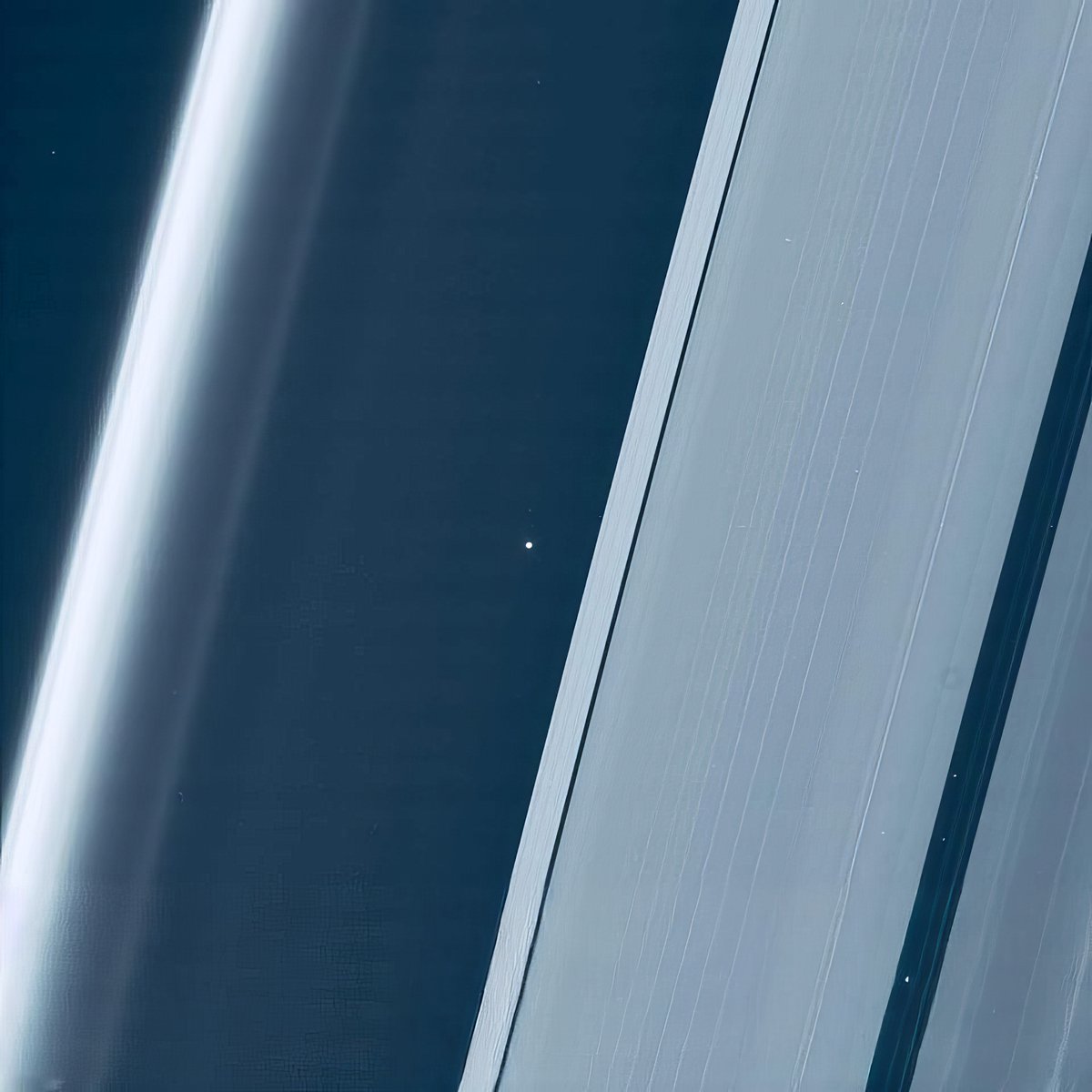 Earth and Moon between the rings of Saturn.