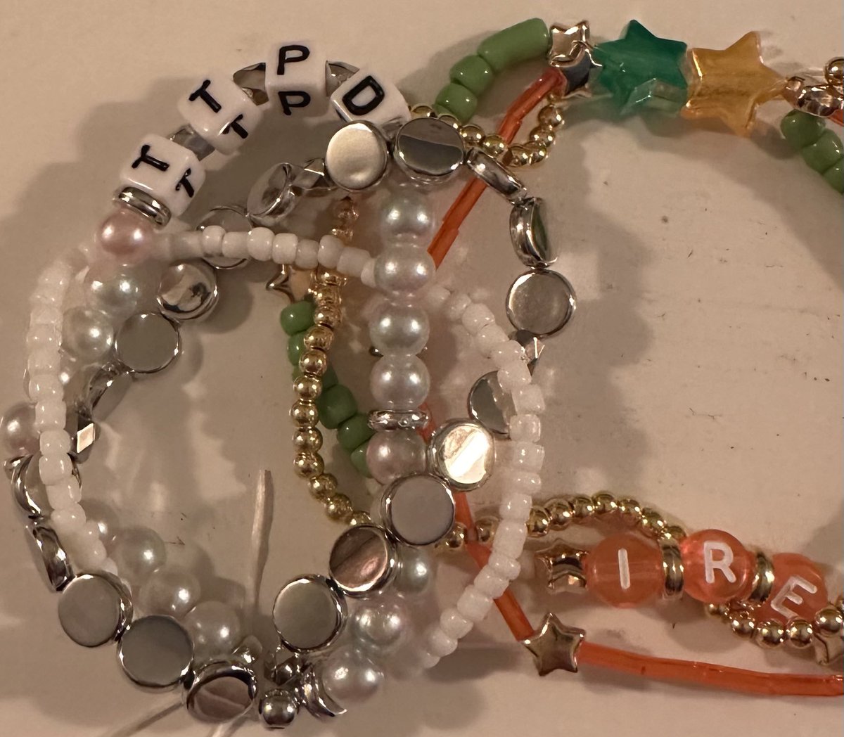 jenkinne's tweet photo. @taylornation13 Present. Just making bracelets while waiting 🤍🩶🖤 https://t.co/oBvCCgCK1t