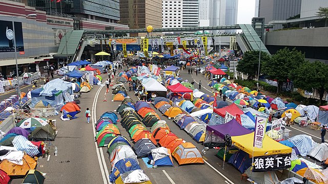 MOVEMENT PLACE-(RE)MAKING – OCCUPY MOVEMENTS TENTH ANNIVERSARY LOOK BACK Written by Klavier Wang. Image credit: Umbrella Movement Tents (35223638963) by qbix08 from United Kingdom/ Wikimedia Commons, license: CC BY-SA 2.0 DEED. Read more at taiwaninsight.org/2024/04/19/mov…