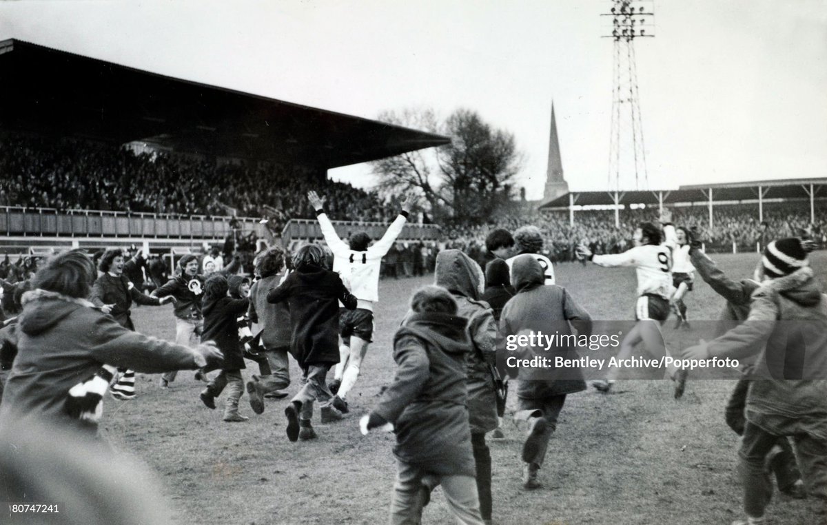 FA. Cup 3rd Round Replay at Edgar Street, Hereford. Hereford United 2 v Newcastle United 1. a.e.t. Hereford fans and players rush to the No 11 Ronnie Radford who had scored a late equaliser to level the scores. (1972)