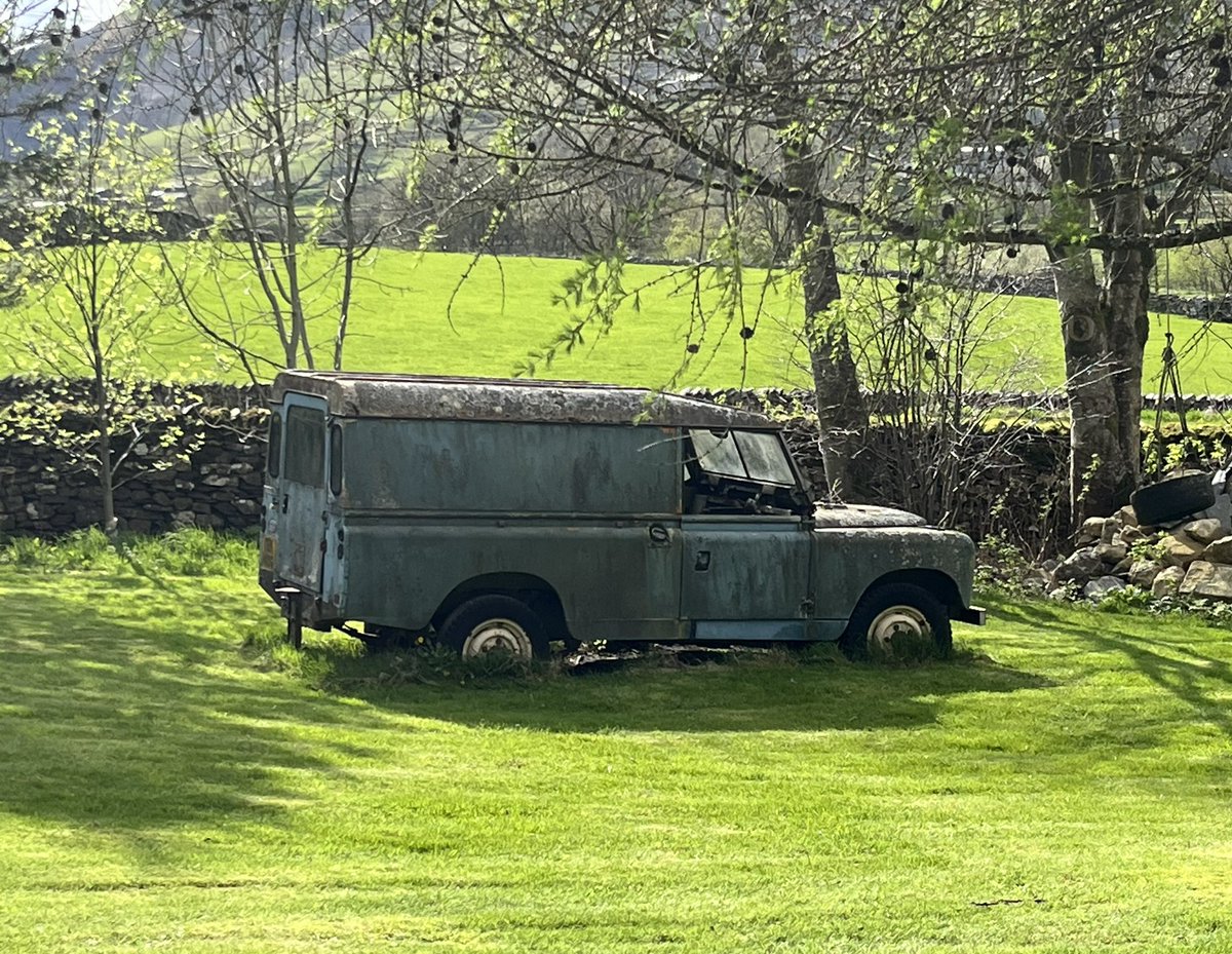 A Land Rover, used as a garden feature …..