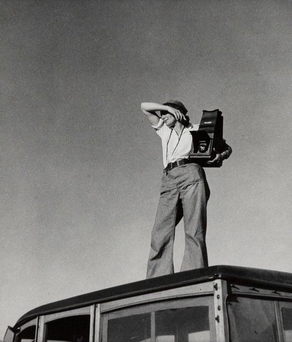 Photographer Dorothea Lange with her camera in California, 1938 whose work humanized the consequences of the Great Depression and influenced the development of documentary photography #WomensArt