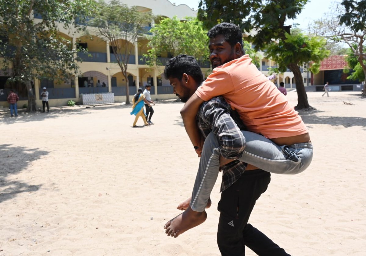 A man carries disabled voter from a polling booth in Chennai’s Tiruvottiyur on Friday. Photo by C Suresh Kumar