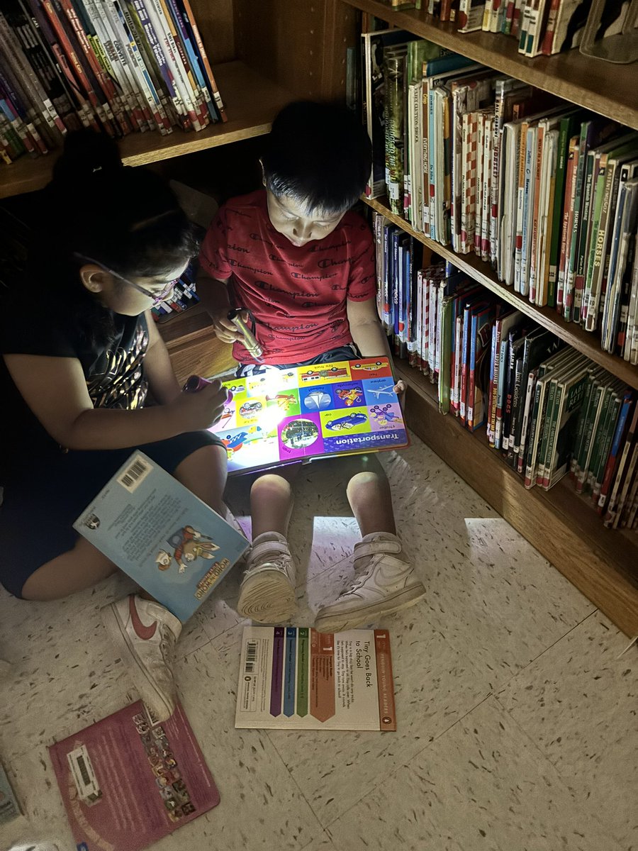 We enjoyed flashlight reading in the library to start our Friday! 📚 🔦