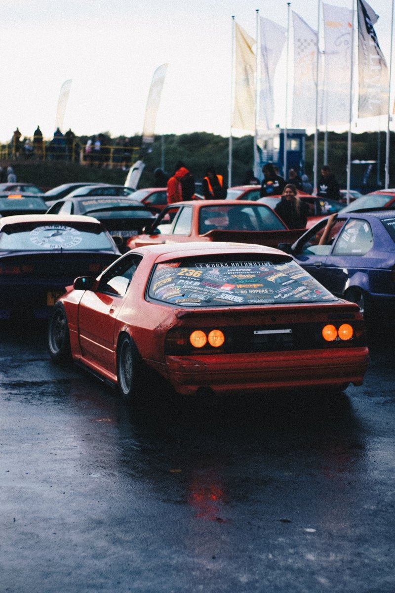 web_shakti77755's tweet image. Vivid red car, lit rear lights, surrounded by enthusiasts and event flags.
Is this the perfect evening for car culture fans? 

#CarCulture #CarEnthusiasts #EventFlags #RedCar #NightGathering
