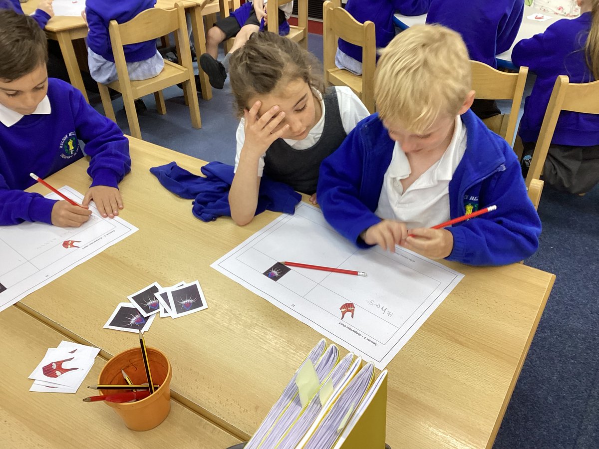 Teamwork in Year One, working with a partner to add detail to our sentences.