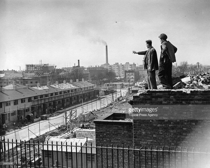 #OTD Postwar Housing In Poplar A slum clearance operation in Poplar, East London, 19th April 1951. The workers are standing on the ruins of Trinity Church, largely destroyed in the Blitz.