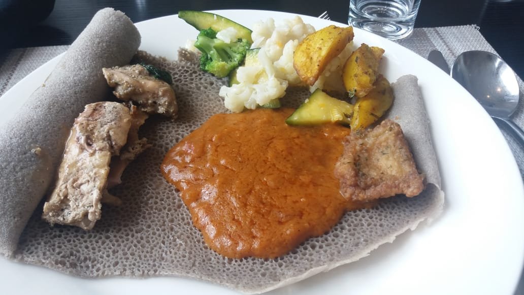 In Addis today. A great lunch - traditional injera made from genuine teff and shiro (chickpea sauce). I love shiro. Food always unites humanity even when politics divides them.