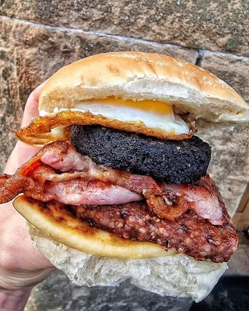 Scottish breakfast roll. Sunny side up egg, black pudding, back bacon and Lorne sausage... GET IN MY BELLY! [not my image]