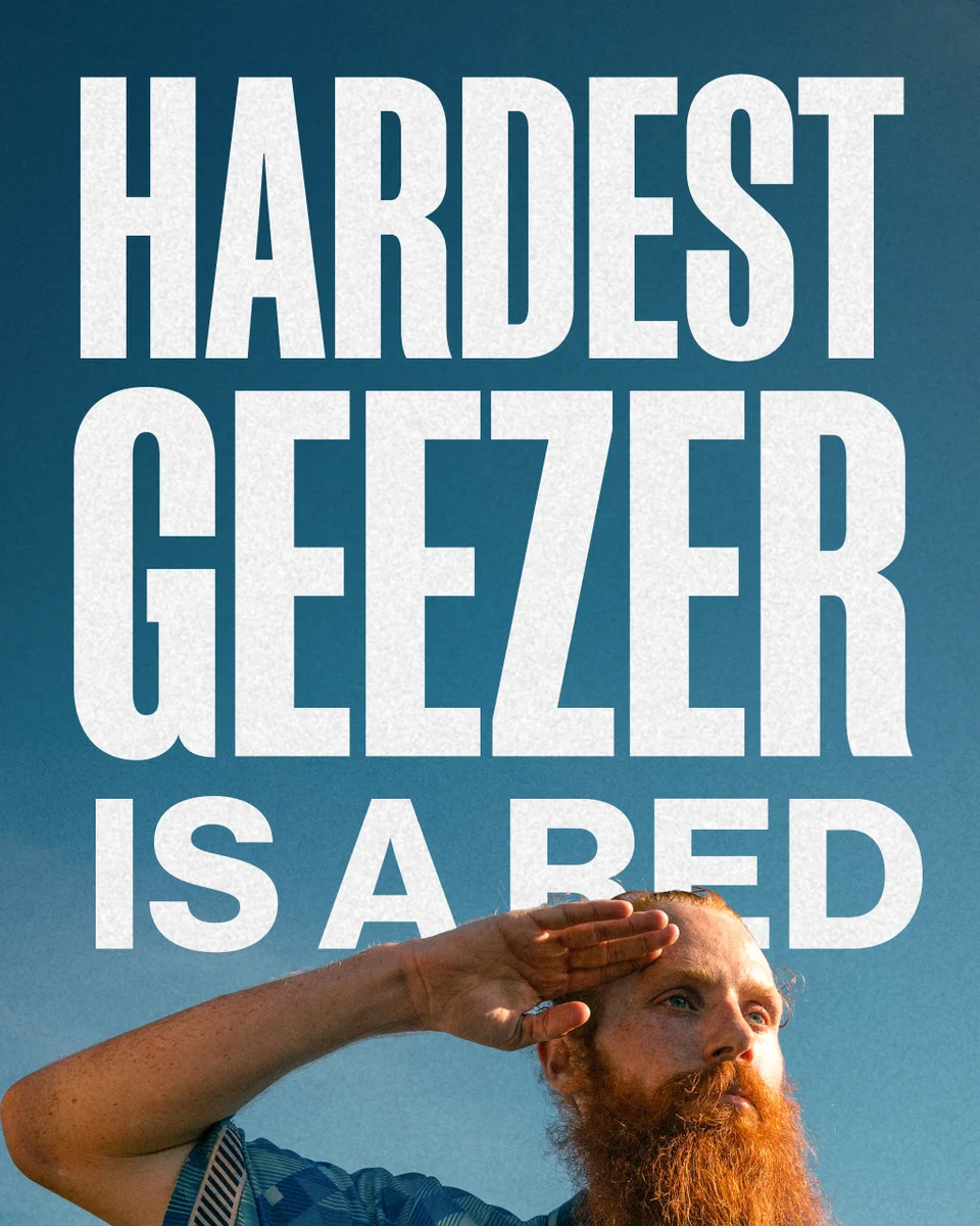 A poster will the words "Hardest Geezer is a Red" in big letters featuring a picture of Russ Cook at the bottom