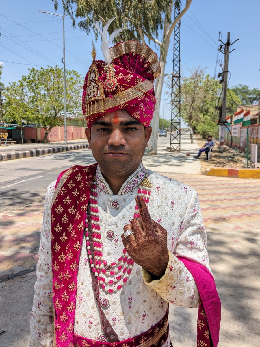 Of course we found a groom in full regalia at a polling station. Of course we interviewed him.