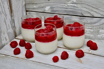 Spring is the perfect time to enjoy a light dessert.  Try my Honey Panna Cotta with Raspberry Sauce.  For this recipe, visit my blog on my website at CarolAnnKates.com #carolannkates #groceryshoppingsecrets #foodtips #foodblogger #dessert #foodie #raspberries