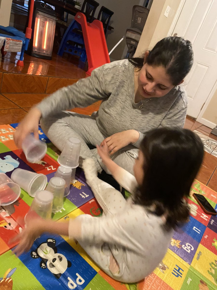 In a PAT visit student C is stacking cups and following the leader with mom. #pat #dph #parentsasteachers #familia #familyinvolvement