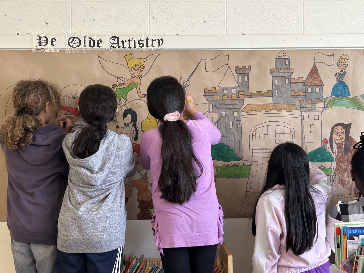 Getting lots of help to colour in our class mural. #collaboration