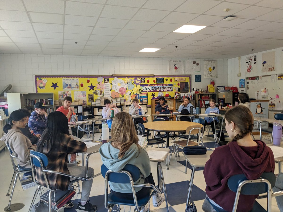 8th grade readers participating in a student-led Socratic Seminar! Through rich dialogue and thoughtful questioning, learners made connections across texts and grappled with some of the complex ethical dilemmas presented in dystopian literature.