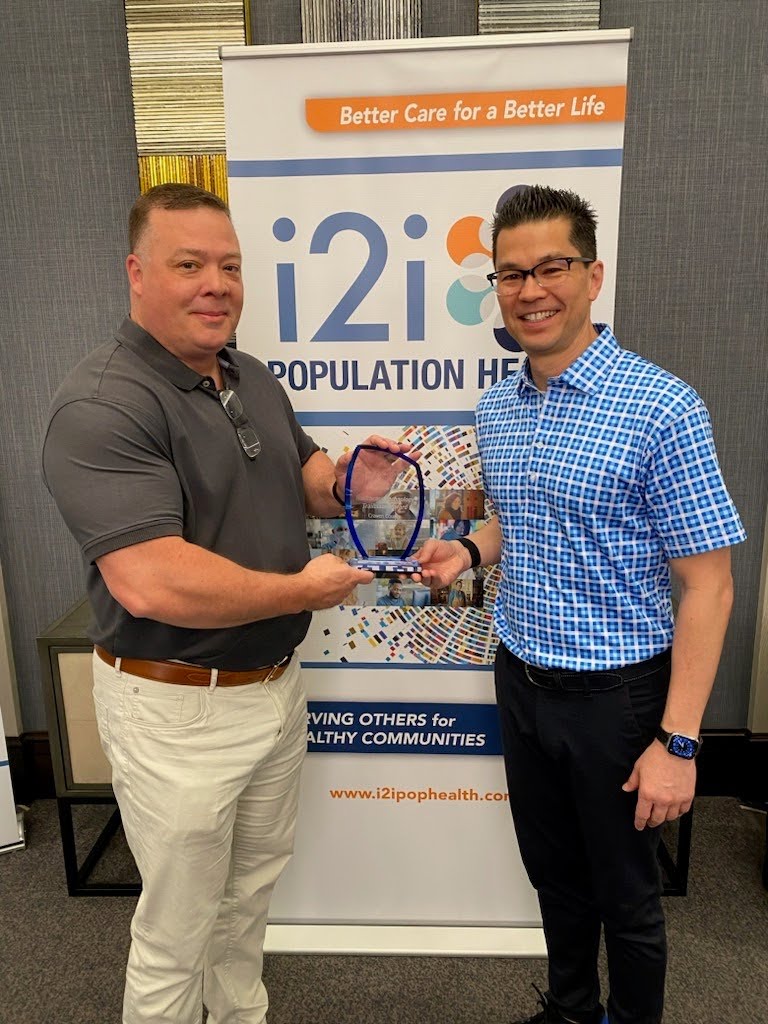 Scott Harrelson, CEO, Craven County Health Center & Health Department accepts the i2i Healthcare Technology Trailblazer Award at the i2i Client Conference. #i2iCC2024