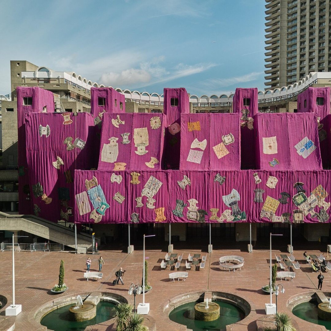 Ghanaian artist Ibrahim Mahama collaborated with hundreds of craftspeople to create a handsewn installation of bespoke pink cloth covering the brutalist lakeside terrace of London's Barbican Centre. #PinkFriday