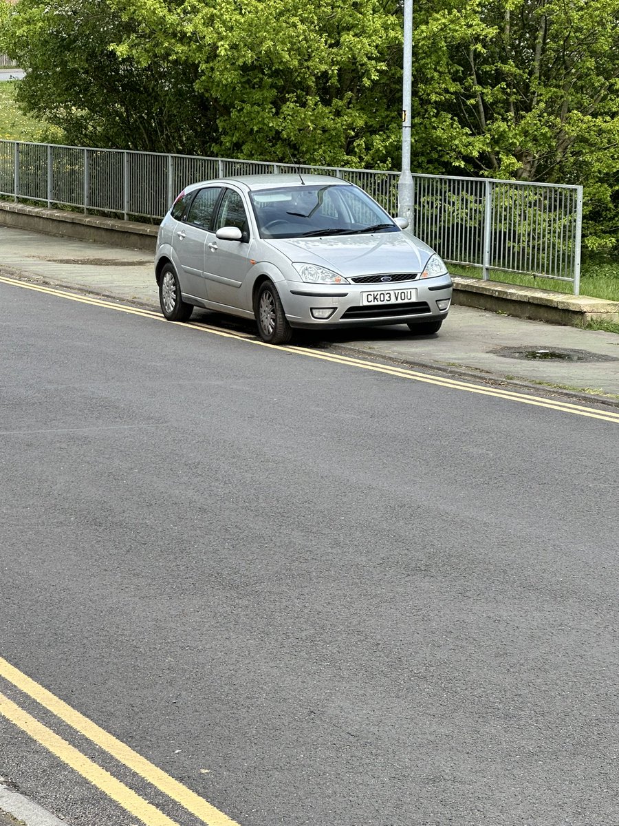 Reg no CK03 VOU parked in Queensway Melksham Wiltshire on Tuesday April 16 2024 at 2.06pm. Parked on double yellow lines, and partially on the footpath, obstructing pedestrian access.