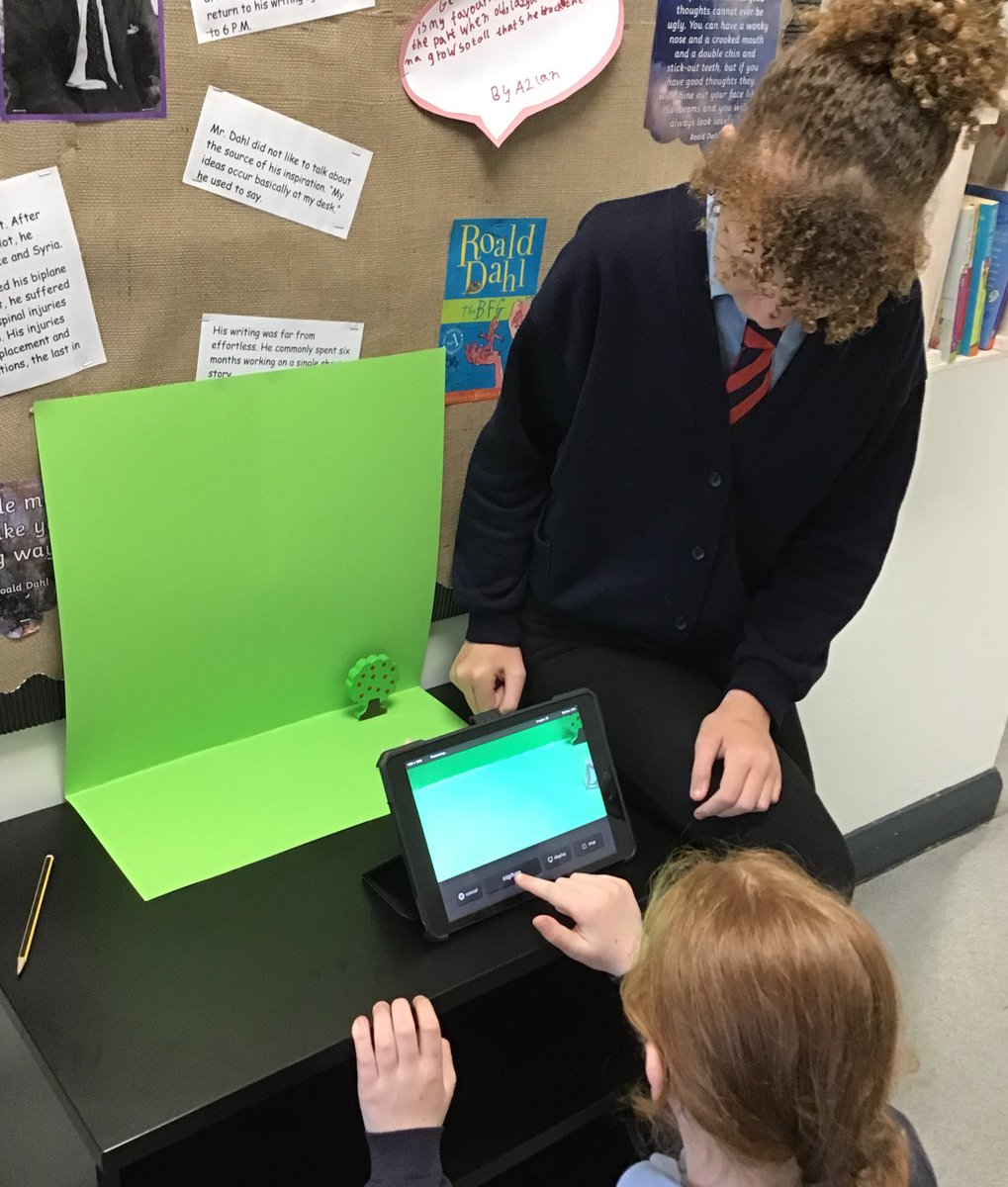 After tinkering with creating a stop motion video last week, this afternoon Year 5 planned a new video on a storyboard, then filmed it in front of a green screen before editing and changing the background in iMovie.
