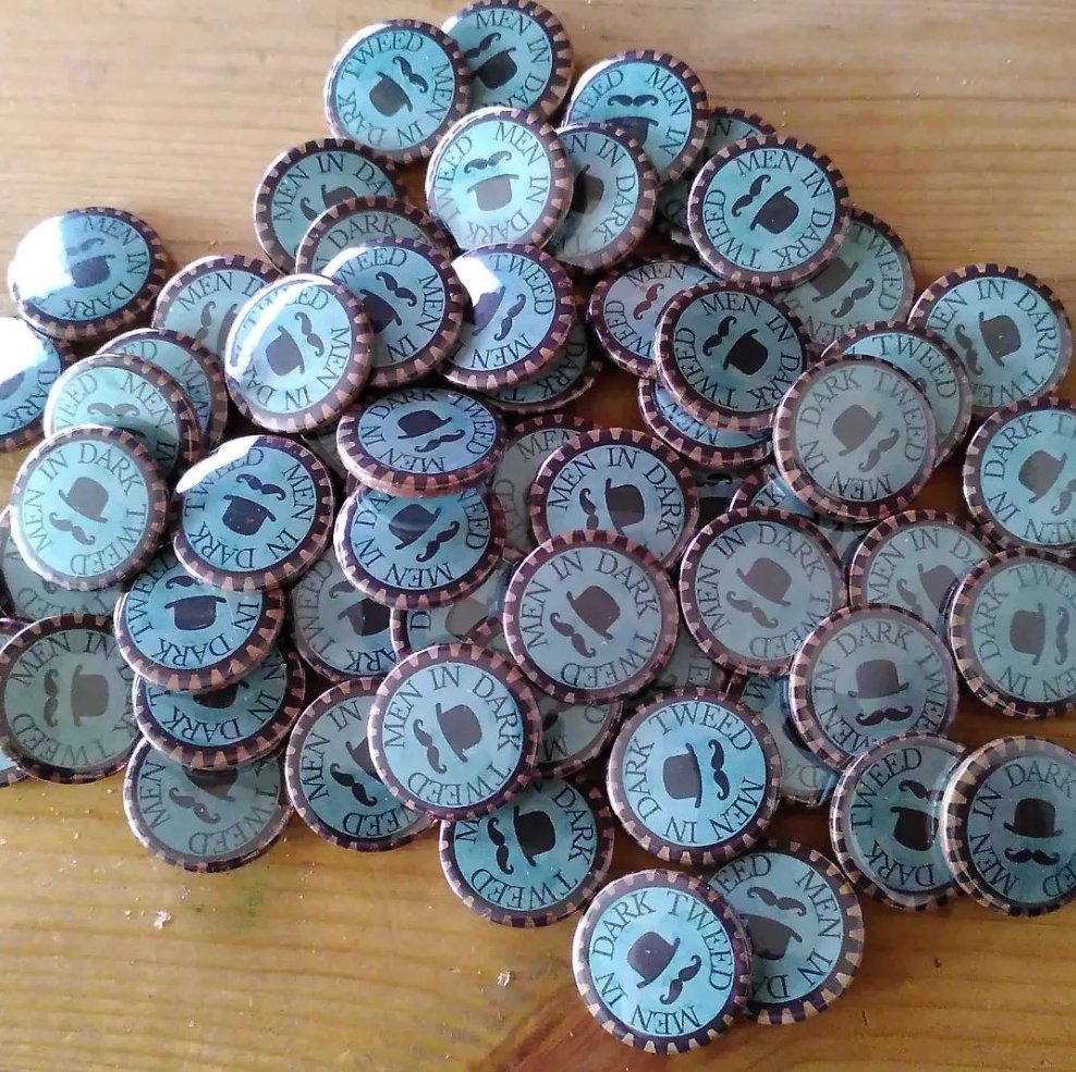 Badges for Secret Victorian organisation protecting the crown from the rum and uncanny? Available from a Man dressed in Dark Tweed pretending to be selling books? I could not possibly comment... #steampunk @scifiscarbs #menindarktweed #books