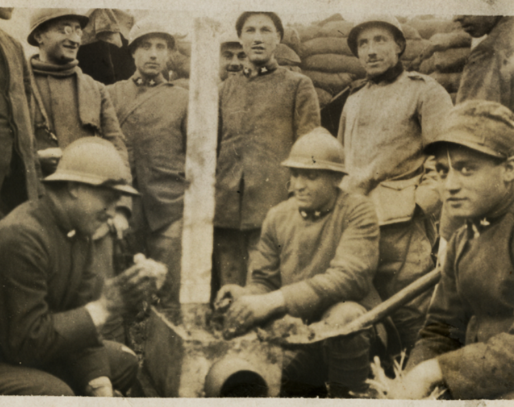 Italian soldiers in the trenches toasting polenta on a stove. #ww1feeding #ww1italianfront